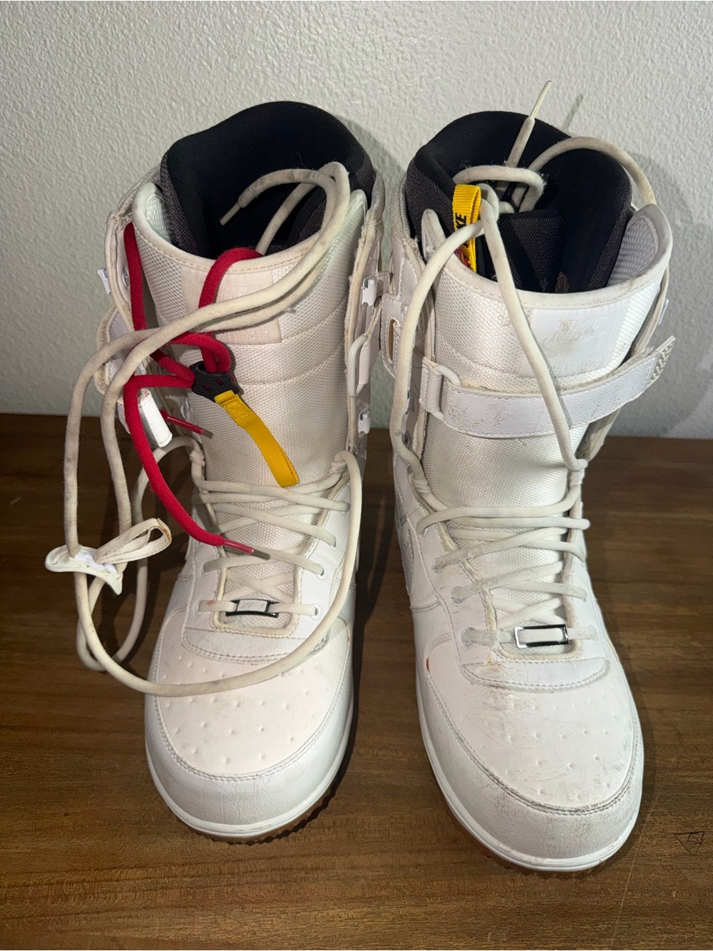 Nike White High-Top Snow Boots with Red and Yellow Accents